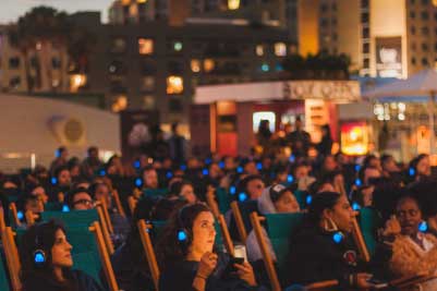 people enjoying a movie with headphones on