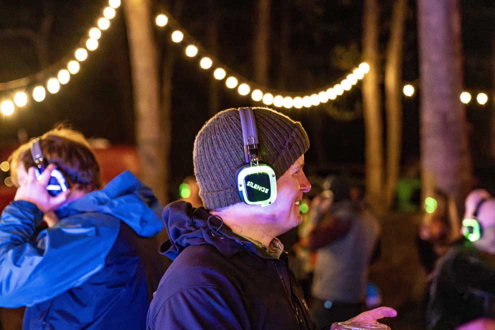 Crowd dancing at a DIY silent disco event