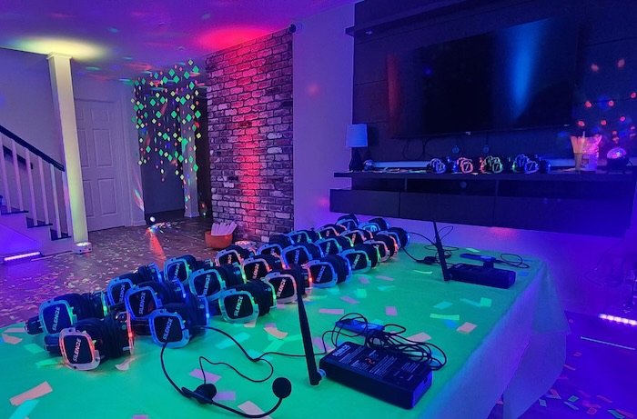 Mitzvah attendees wearing silent headphones while focused on a presenter